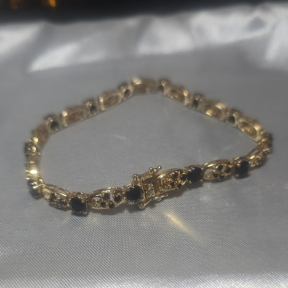 Elegant Gold and Black Bracelet